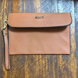 Tan leather clutch bag with gold hardware and magnetic closure